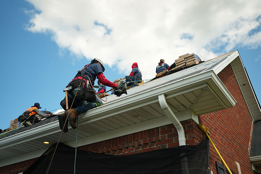 Roof repair company on house